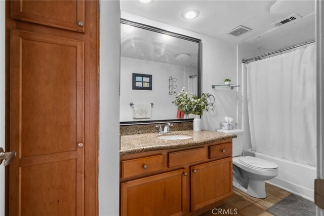 2045 Las Colinas Cir Unit 103, Corona, CA 92879 - full bathroom featuring tile patterned floors, vanity, toilet, and shower / bathtub combination with curtain