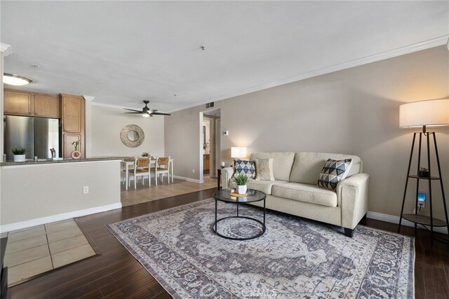 2045 Las Colinas Cir Unit 103, Corona, CA 92879 - living area with ceiling fan, crown molding, dark wood-style flooring, and baseboards