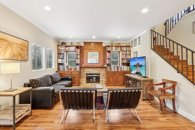 856 E Rio Grande St, Pasadena, CA 91104 - living area with light wood finished floors, ornamental molding, recessed lighting, stairway, and a stone fireplace