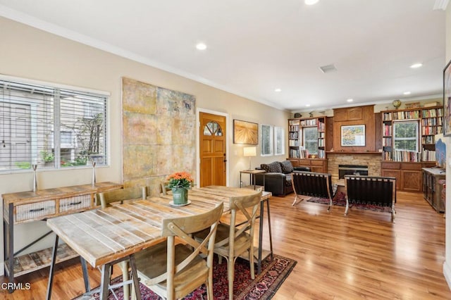 856 E Rio Grande St, Pasadena, CA 91104 - dining space featuring crown molding, recessed lighting, light wood-type flooring, and a fireplace