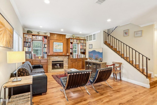 856 E Rio Grande St, Pasadena, CA 91104 - living area with ornamental molding, a stone fireplace, stairs, light wood-style floors, and recessed lighting