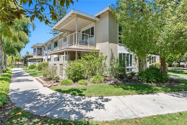 780P Via Los Altos, Laguna Woods, CA 92637 - view of home's exterior featuring stucco siding and a balcony