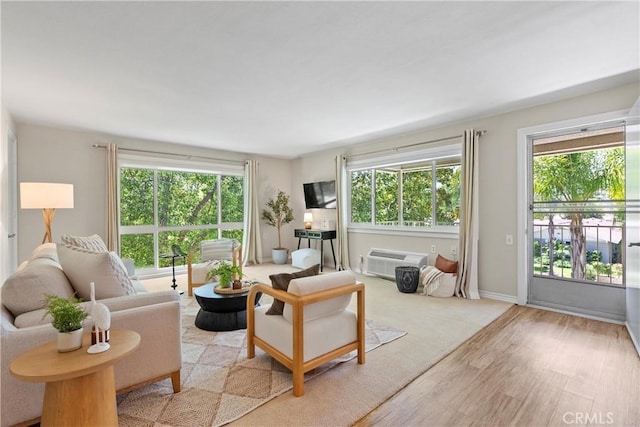 780P Via Los Altos, Laguna Woods, CA 92637 - living room with light wood-type flooring, healthy amount of natural light, and a wall mounted AC