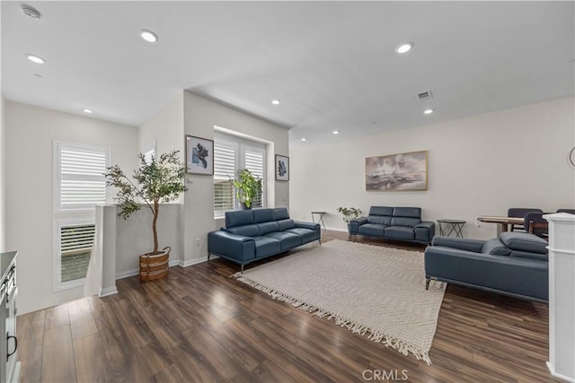 living area with wood finished floors, recessed lighting, and baseboards