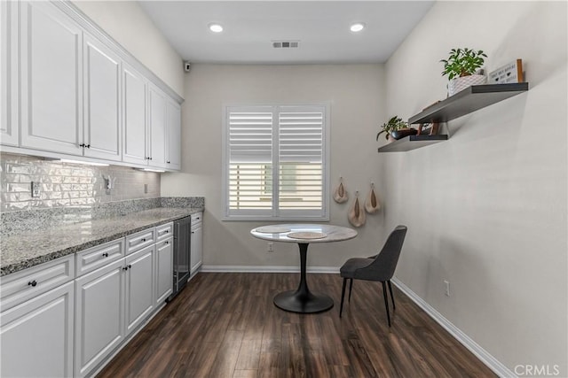 kitchen featuring wine cooler, dark wood finished floors, white cabinets, decorative backsplash, and recessed lighting
