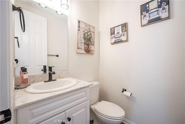 half bath with toilet and vanity