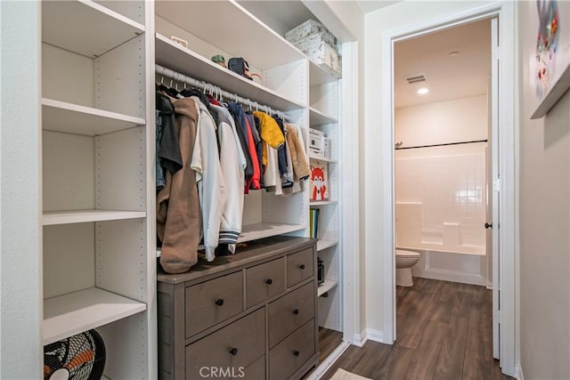 135 Neptune, Irvine, CA 92618 - walk in closet featuring dark wood finished floors