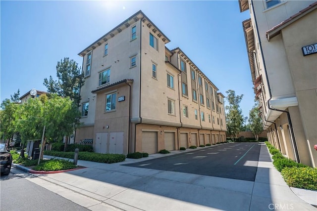 135 Neptune, Irvine, CA 92618 - view of building exterior featuring an attached garage