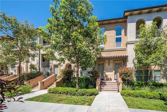 135 Neptune, Irvine, CA 92618 - view of property featuring stucco siding