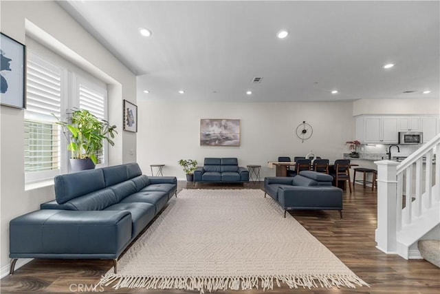 135 Neptune, Irvine, CA 92618 - living room with recessed lighting, dark wood-type flooring, baseboards, and stairway