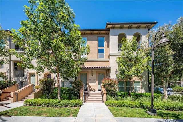 135 Neptune, Irvine, CA 92618 - view of front of home with stucco siding