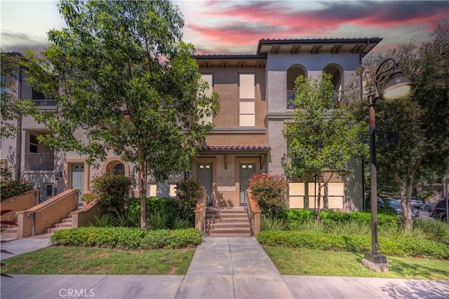 135 Neptune, Irvine, CA 92618 - view of front of home featuring stucco siding