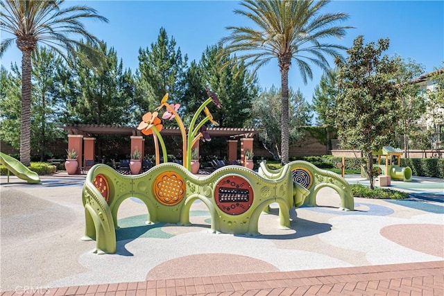 view of playground featuring a pergola
