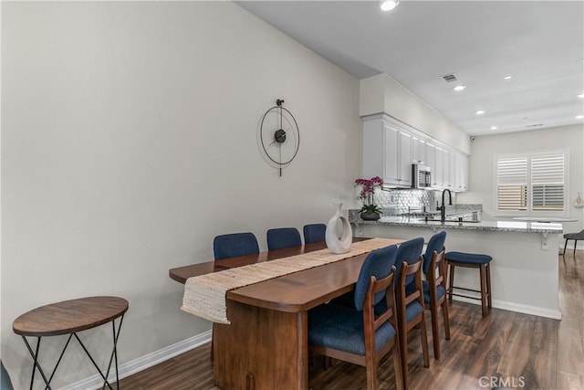 135 Neptune, Irvine, CA 92618 - dining space with dark wood-style flooring and recessed lighting