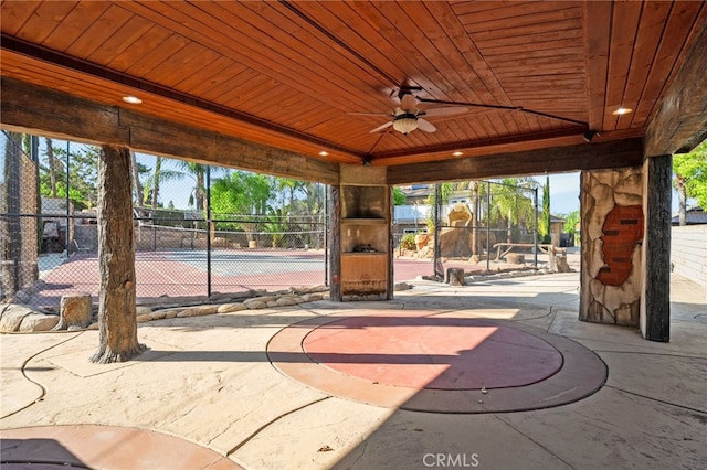 view of patio with a ceiling fan and fence