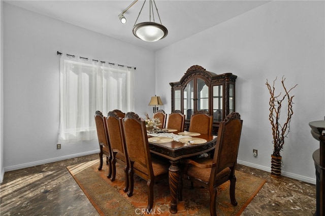 dining room featuring baseboards