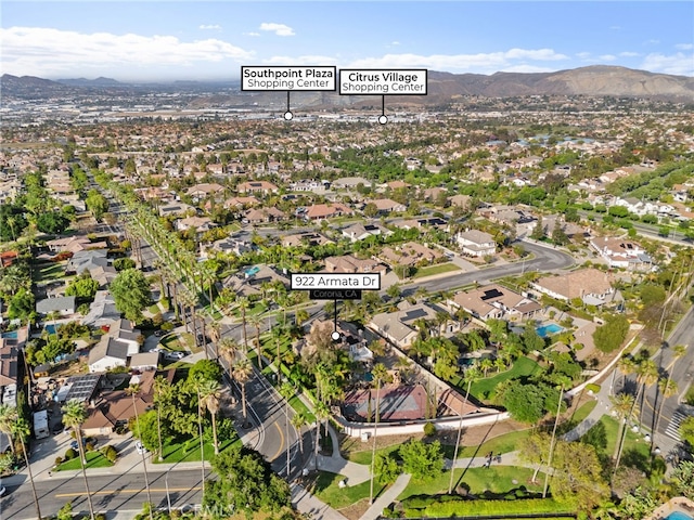 aerial view of residential area featuring a mountain backdrop