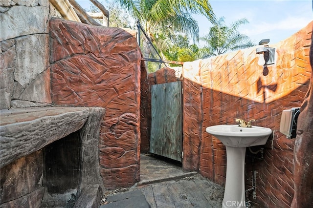 bathroom with hardwood / wood-style floors and a sink