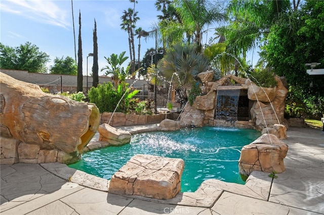 view of pool featuring a fenced backyard and a patio area