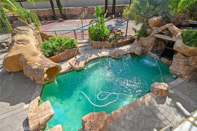 view of pool with fence
