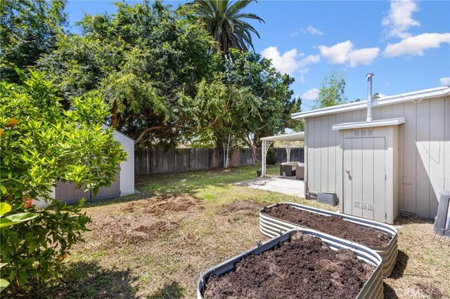 810 W Rte 66, Glendora, CA 91740 - view of yard featuring a storage unit, an outdoor structure, a patio, and a garden