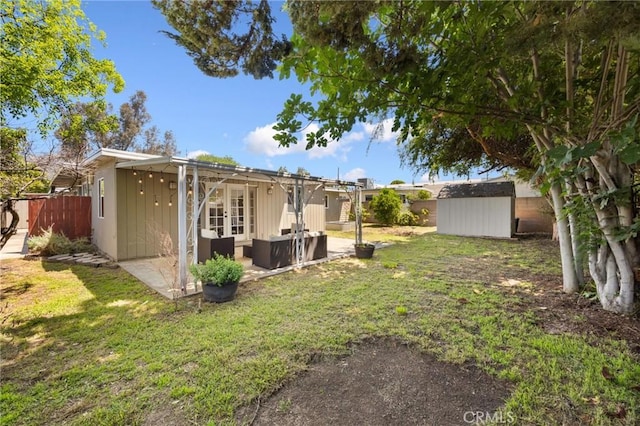 810 W Rte 66, Glendora, CA 91740 - view of yard with a storage unit, french doors, an outbuilding, an outdoor living space, and a patio