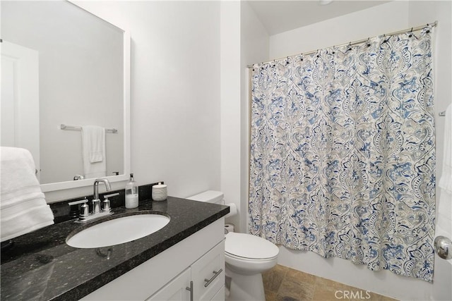 36936 Buccella Ln, Beaumont, CA 92223 - bathroom with vanity, toilet, stone finish floors, and shower / bathtub combination with curtain