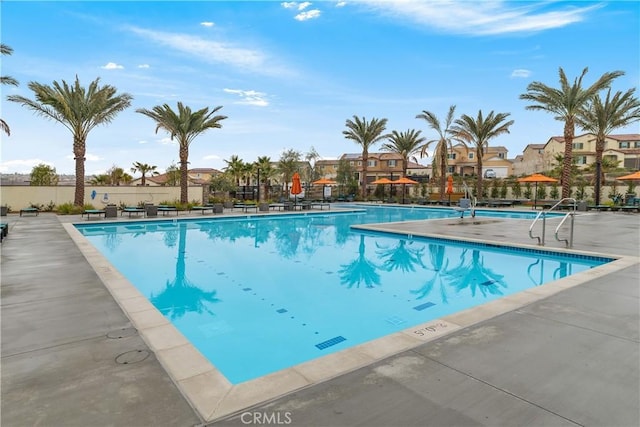 36936 Buccella Ln, Beaumont, CA 92223 - community pool featuring a residential view and a patio
