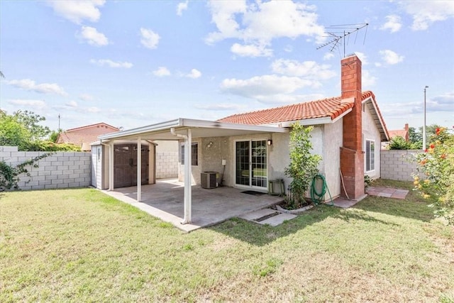 1866 Overland St, Colton, CA 92324 - back of house with stucco siding, a storage unit, a chimney, a patio area, and a tiled roof