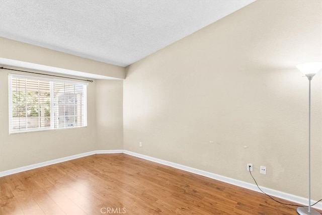 1866 Overland St, Colton, CA 92324 - spare room featuring light wood finished floors and a textured ceiling