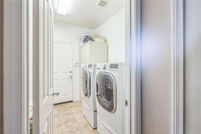 washroom with separate washer and dryer