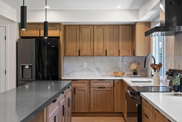 4687 Murat Ct, San Diego, CA 92117 - kitchen with black / electric stove, refrigerator with ice dispenser, wall chimney range hood, brown cabinets, and backsplash