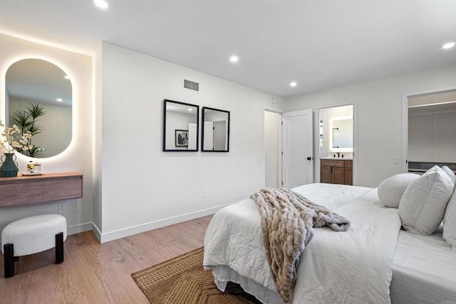 4687 Murat Ct, San Diego, CA 92117 - bedroom with light wood-type flooring, recessed lighting, ensuite bathroom, and a spacious closet