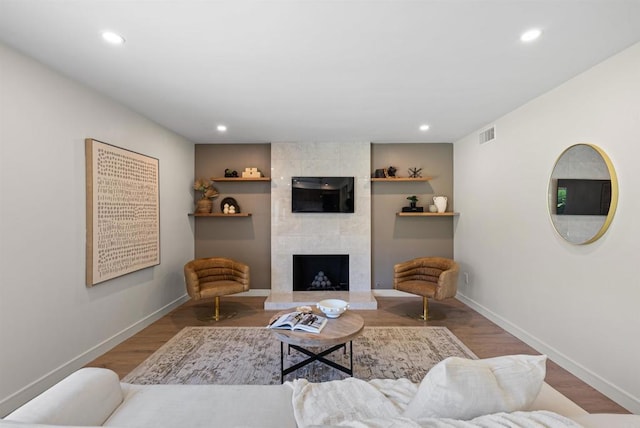 4687 Murat Ct, San Diego, CA 92117 - living room featuring recessed lighting, a tile fireplace, and wood finished floors