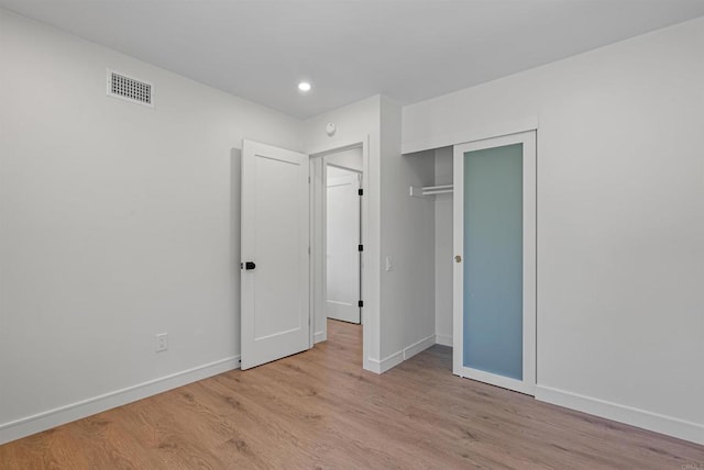 4687 Murat Ct, San Diego, CA 92117 - unfurnished bedroom featuring wood finished floors, recessed lighting, and a closet