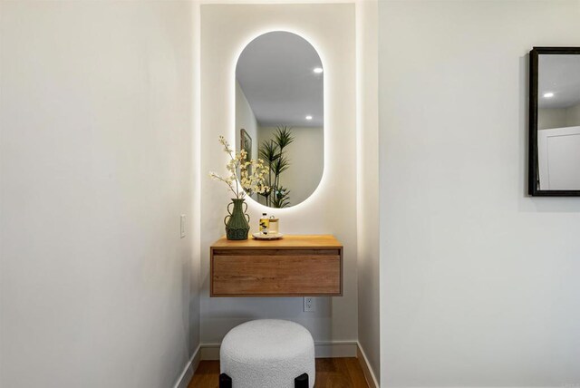 4687 Murat Ct, San Diego, CA 92117 - hallway with dark wood-style floors and arched walkways