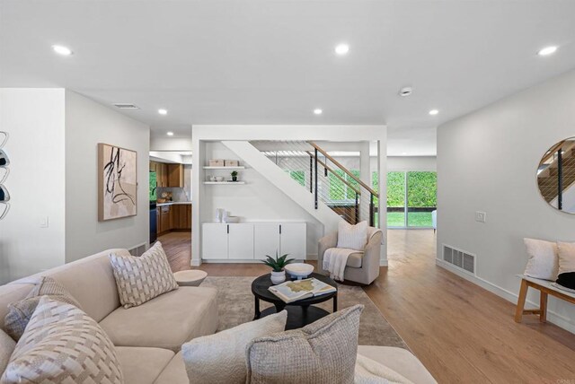 4687 Murat Ct, San Diego, CA 92117 - living area with stairs, light wood-style floors, and recessed lighting
