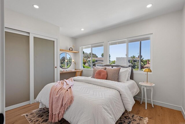 4687 Murat Ct, San Diego, CA 92117 - bedroom with recessed lighting and light wood-style flooring