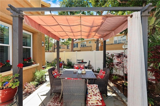 5126 E Paddington Ct Unit F, Orange, CA 92867 - view of patio / terrace featuring fence, a pergola, and outdoor dining area