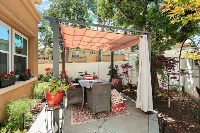 5126 E Paddington Ct Unit F, Orange, CA 92867 - view of patio / terrace with a pergola, fence, and outdoor dining space