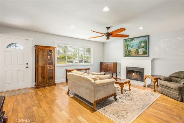 9914 Albany Ave, Rancho Cucamonga, CA 91701 - living area with a fireplace, a ceiling fan, light wood finished floors, recessed lighting, and baseboards