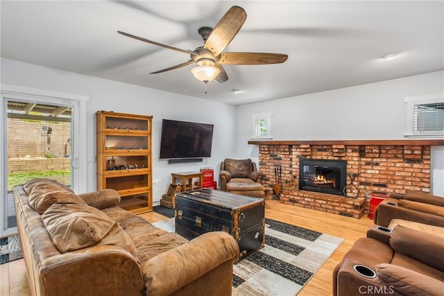 9914 Albany Ave, Rancho Cucamonga, CA 91701 - living room featuring a ceiling fan, a fireplace, and wood finished floors