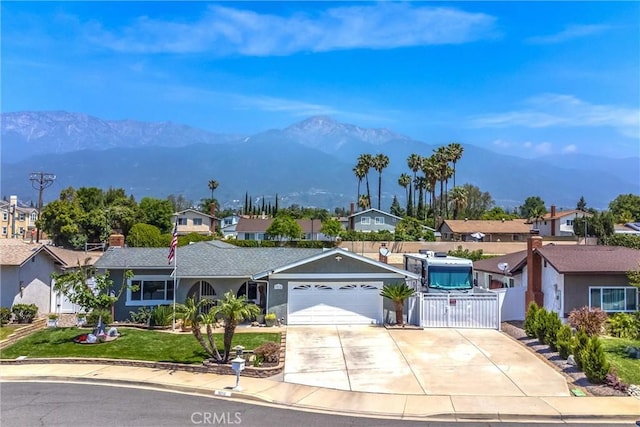 9914 Albany Ave, Rancho Cucamonga, CA 91701 - ranch-style home featuring a residential view, a mountain view, concrete driveway, and an attached garage