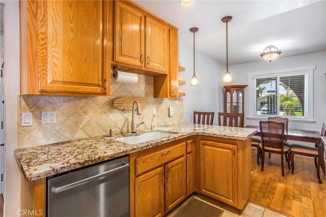 9914 Albany Ave, Rancho Cucamonga, CA 91701 - kitchen featuring stainless steel dishwasher, a sink, light stone countertops, and tasteful backsplash