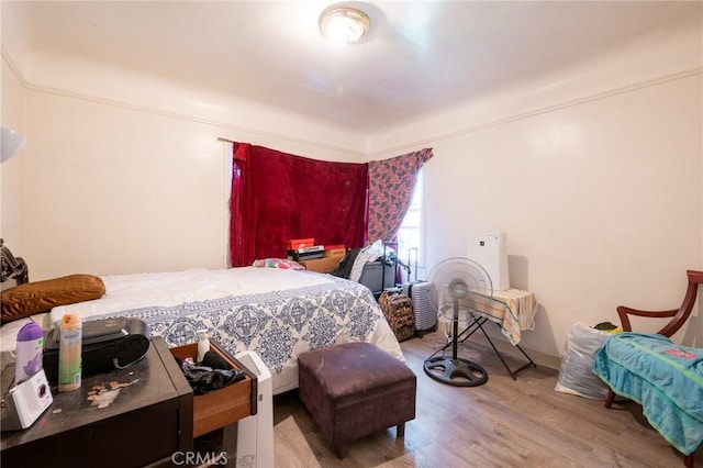bedroom featuring wood finished floors