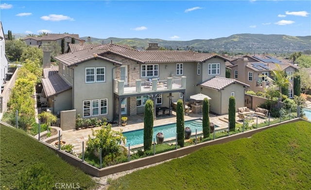 27371 Via Priorato, San Juan Capistrano, CA 92675 - back of property with a balcony, stucco siding, a chimney, a tiled roof, and a residential view