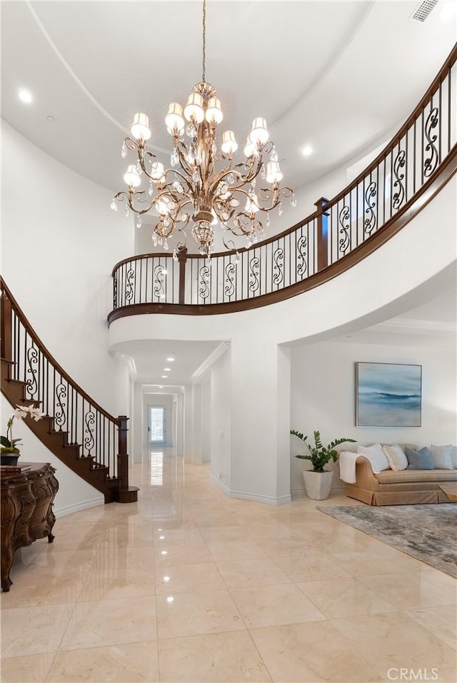 27371 Via Priorato, San Juan Capistrano, CA 92675 - entrance foyer with a high ceiling, a chandelier, baseboards, stairway, and marble tiled floors