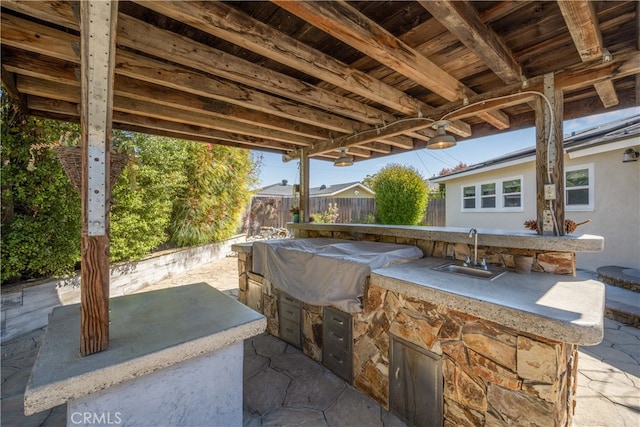 2731 N Rutgers Ave, Long Beach, CA 90815 - view of patio with a sink, fence, and an outdoor kitchen