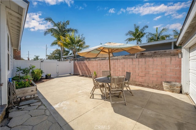 2731 N Rutgers Ave, Long Beach, CA 90815 - view of patio / terrace with a gate, outdoor dining space, and a fenced backyard