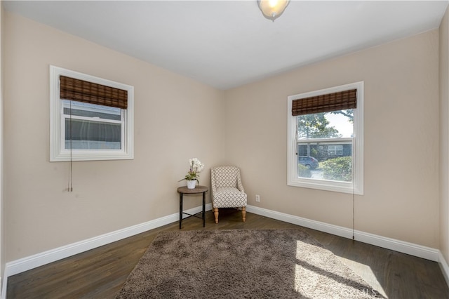 2731 N Rutgers Ave, Long Beach, CA 90815 - living area featuring dark wood-style floors and baseboards